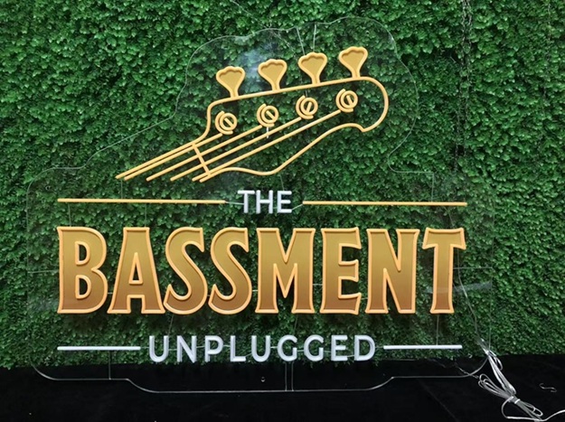 Music shop custom split neon sign with bass headstock graphic.